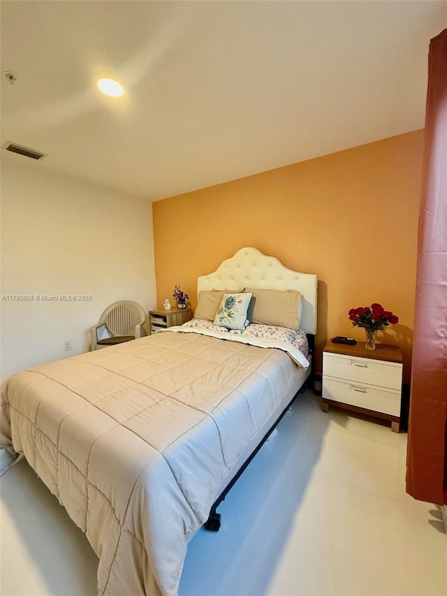 carpeted bedroom featuring recessed lighting and visible vents