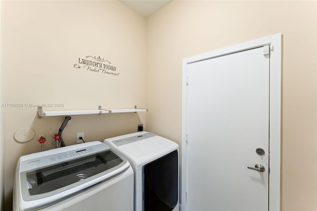laundry room with separate washer and dryer and laundry area