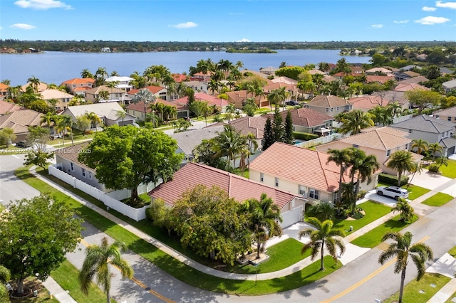 birds eye view of property featuring a water view and a residential view