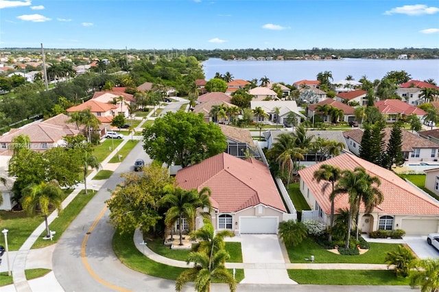 bird's eye view with a water view and a residential view