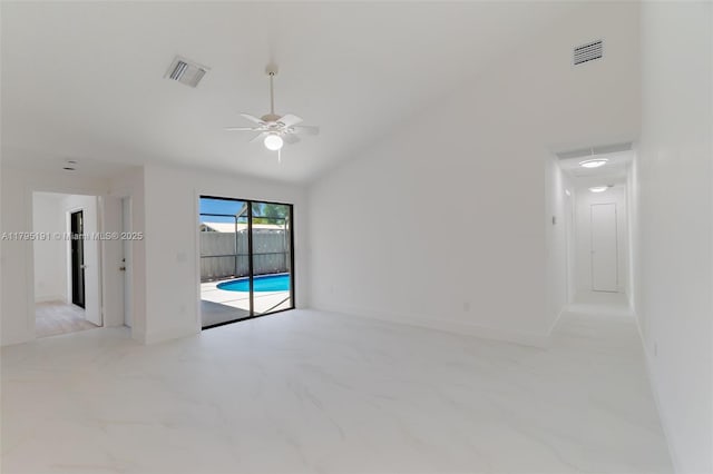 5926 Golden Eagle Cir, Palm Beach Gardens, FL 33418 - unfurnished room featuring ceiling fan, light marble finish floors, and vaulted ceiling