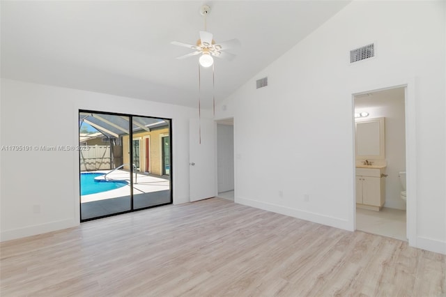 5926 Golden Eagle Cir, Palm Beach Gardens, FL 33418 - spare room with ceiling fan, high vaulted ceiling, wood finished floors, baseboards, and a sink