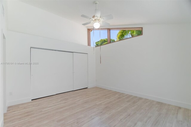 5926 Golden Eagle Cir, Palm Beach Gardens, FL 33418 - empty room featuring wood finished floors, a ceiling fan, and baseboards