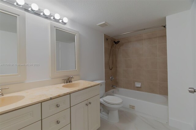 5926 Golden Eagle Cir, Palm Beach Gardens, FL 33418 - full bathroom with toilet, a textured ceiling, bathtub / shower combination, and double vanity