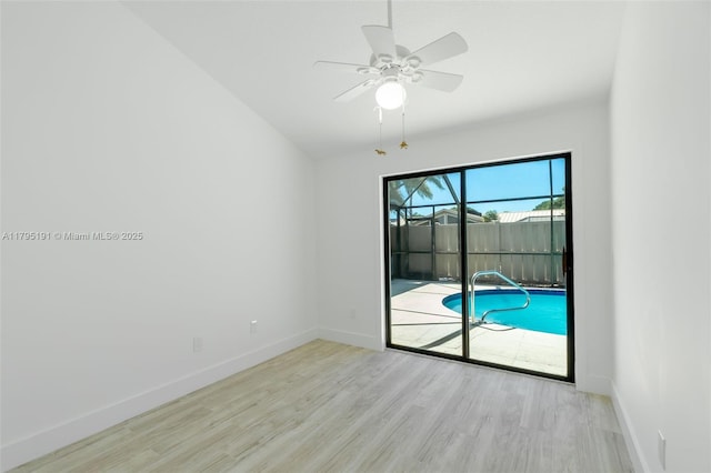 5926 Golden Eagle Cir, Palm Beach Gardens, FL 33418 - empty room featuring wood finished floors, ceiling fan, and baseboards