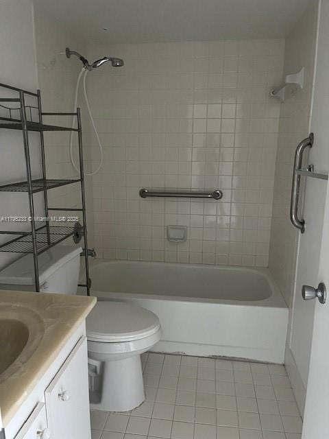 bathroom featuring toilet, tile patterned floors, tub / shower combination, and vanity