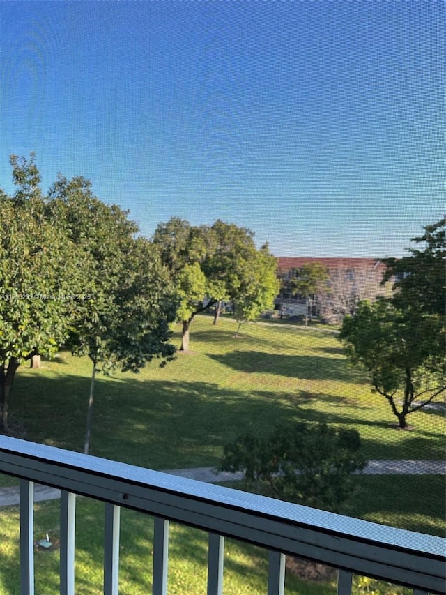 view of yard with a balcony