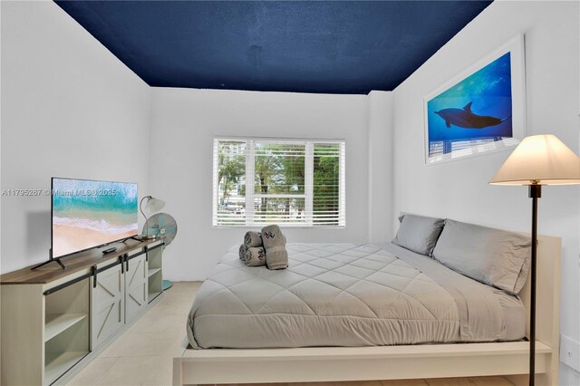 255 W 24th St Unit 302, Miami Beach, FL 33140 - bedroom featuring light tile patterned floors