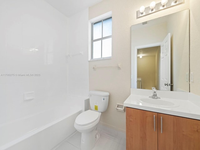 full bathroom with vanity, toilet, baseboards, tile patterned floors, and shower / washtub combination