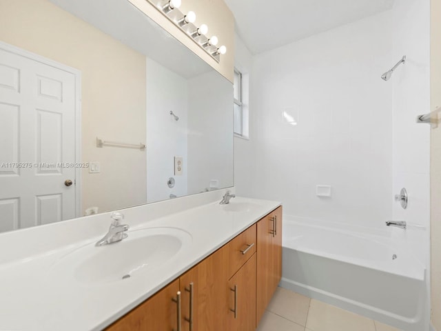 full bathroom featuring shower / bathtub combination, double vanity, a sink, and tile patterned flooring