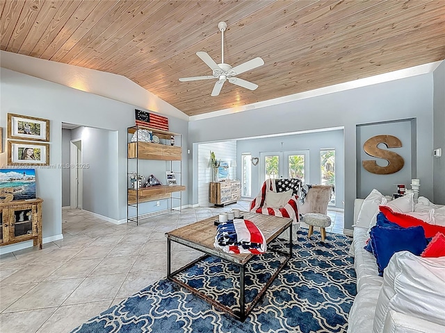 living area featuring lofted ceiling, wood ceiling, a ceiling fan, tile patterned floors, and baseboards