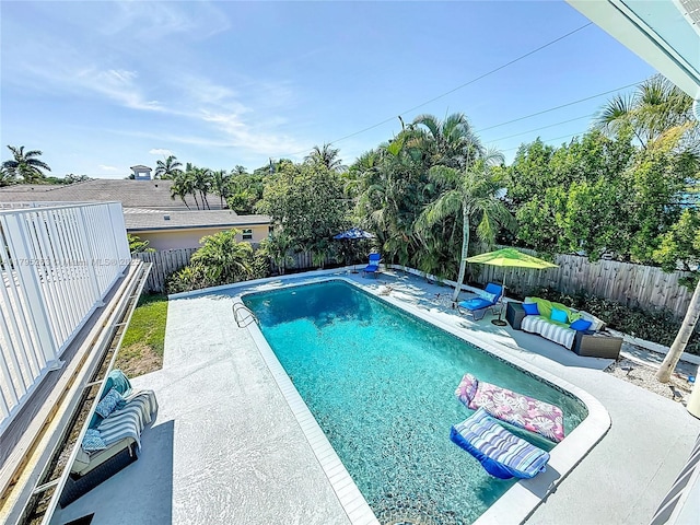 view of pool with a patio and a fenced backyard