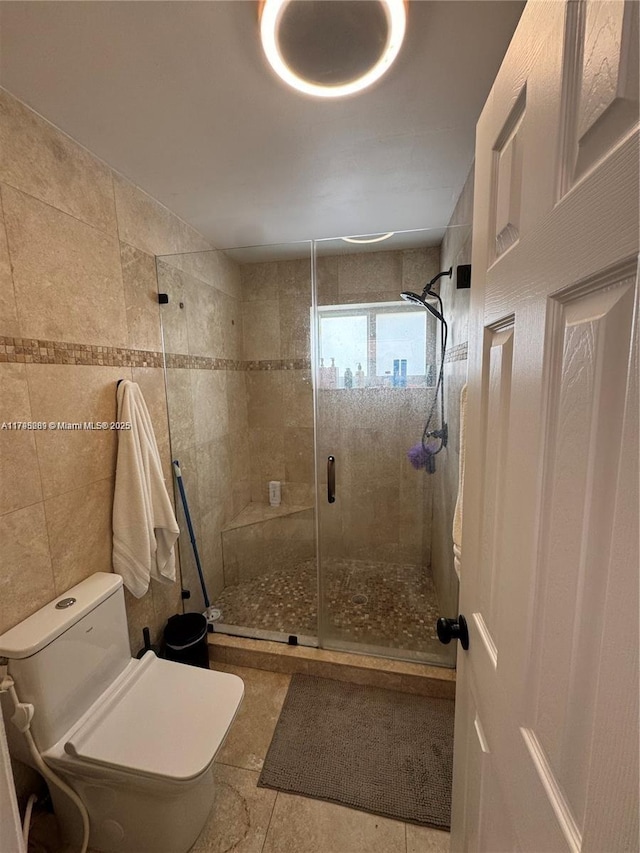 2500 SW 137th Ct, Miami, FL 33175 - bathroom featuring a shower stall, tile walls, toilet, and tile patterned flooring
