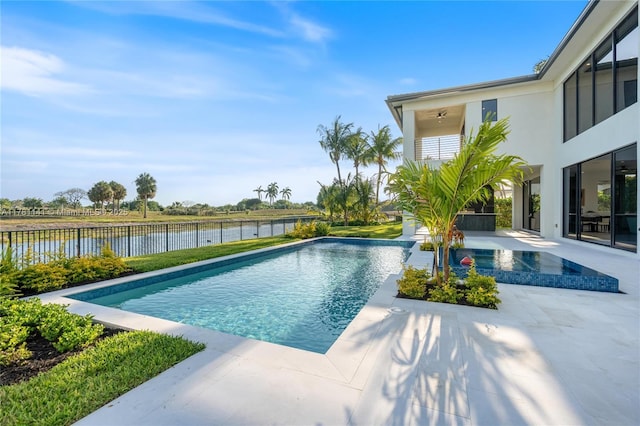 12060 NW 67th Ct, Parkland, FL 33076 - view of pool featuring a water view, a ceiling fan, fence, a patio area, and a fenced in pool