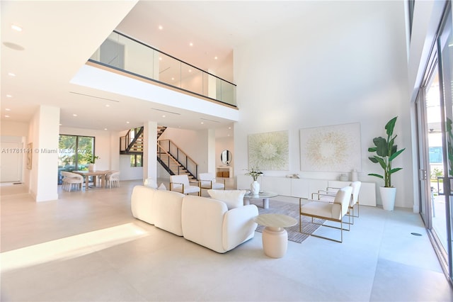 12060 NW 67th Ct, Parkland, FL 33076 - living room with a towering ceiling and stairs