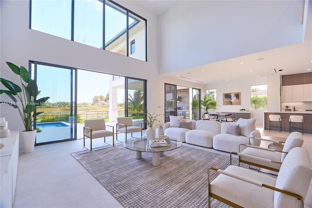 12060 NW 67th Ct, Parkland, FL 33076 - patio terrace at dusk with wine cooler, area for grilling, an outdoor pool, grilling area, and a sink