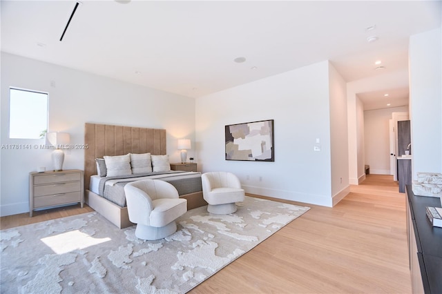 12060 NW 67th Ct, Parkland, FL 33076 - bedroom with light wood-type flooring and baseboards