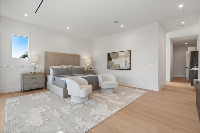 12060 NW 67th Ct, Parkland, FL 33076 - bedroom featuring light wood finished floors, baseboards, and recessed lighting