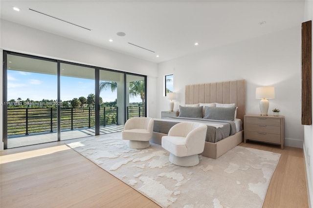 12060 NW 67th Ct, Parkland, FL 33076 - bedroom with access to outside, light wood-style flooring, and recessed lighting