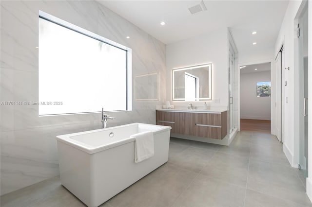 12060 NW 67th Ct, Parkland, FL 33076 - bathroom featuring recessed lighting, visible vents, vanity, and a freestanding tub