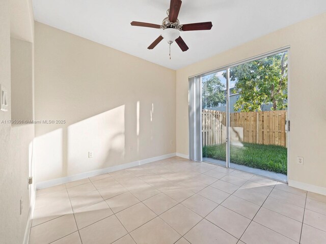 1416 SE 26th Ave, Homestead, FL 33035 - tiled spare room with a ceiling fan and baseboards