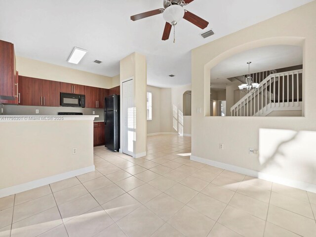 1416 SE 26th Ave, Homestead, FL 33035 - kitchen featuring visible vents, open floor plan, arched walkways, ceiling fan with notable chandelier, and black appliances