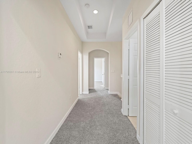 1416 SE 26th Ave, Homestead, FL 33035 - corridor featuring light colored carpet, arched walkways, baseboards, and visible vents