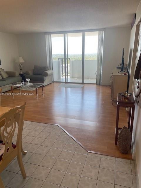 2750 NE 183rd St Unit 2604, Aventura, FL 33160 - living room featuring expansive windows and light wood-style flooring