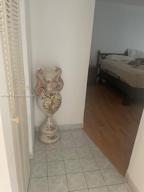 2750 NE 183rd St Unit 2604, Aventura, FL 33160 - interior space with light tile patterned floors and baseboards