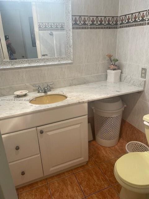 2750 NE 183rd St Unit 2604, Aventura, FL 33160 - bathroom with toilet, tile patterned floors, tile walls, and vanity