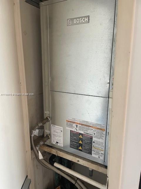2750 NE 183rd St Unit 2604, Aventura, FL 33160 - utility room featuring heating unit