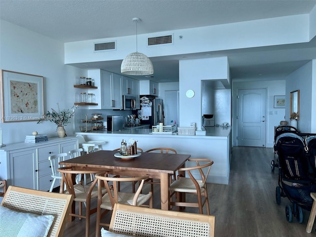 2101 Brickell Ave Unit 3208, Miami, FL 33129 - dining room with visible vents and dark wood finished floors