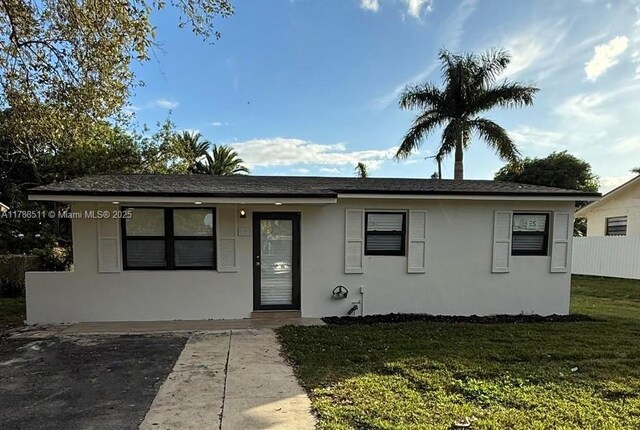 1770 NW 109th St, Miami, FL 33167 - single story home featuring a front lawn and stucco siding