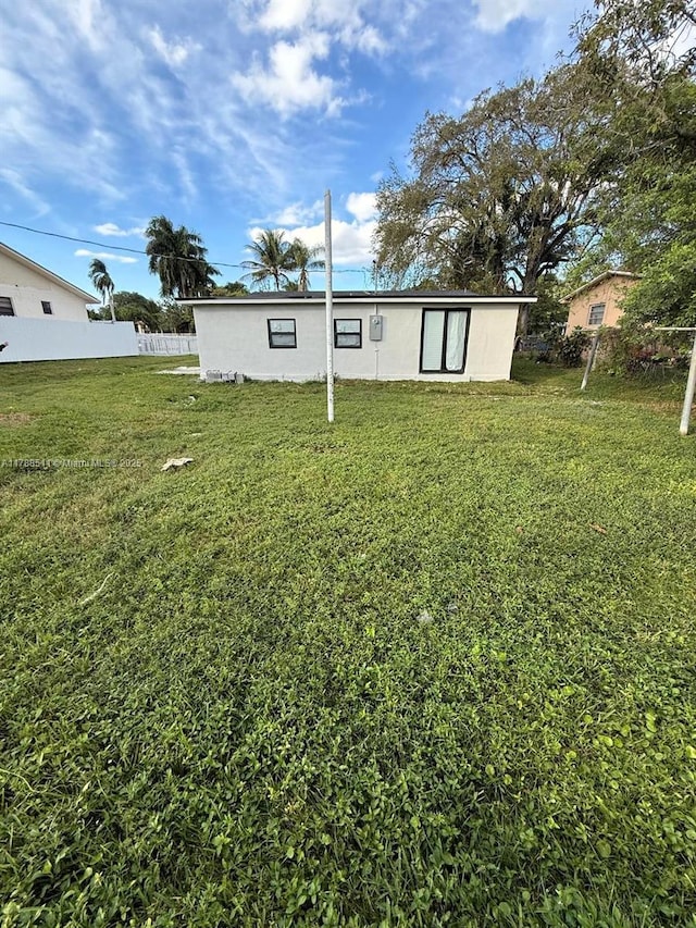 1770 NW 109th St, Miami, FL 33167 - rear view of house featuring fence and a yard