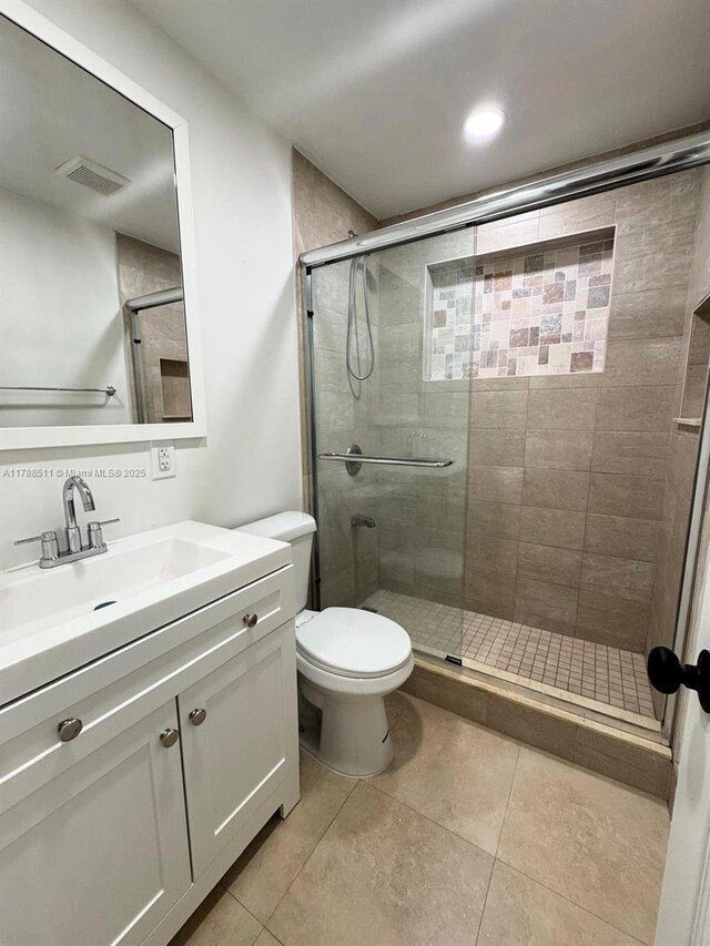 1770 NW 109th St, Miami, FL 33167 - bathroom with vanity, tile patterned flooring, visible vents, toilet, and a shower stall
