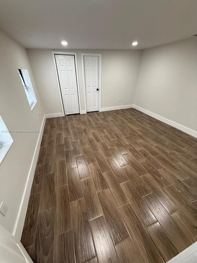 1770 NW 109th St, Miami, FL 33167 - basement featuring baseboards, recessed lighting, and dark wood-type flooring