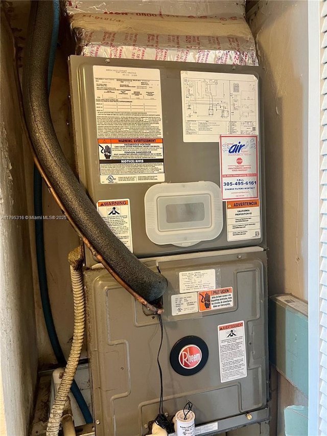 utility room featuring heating unit