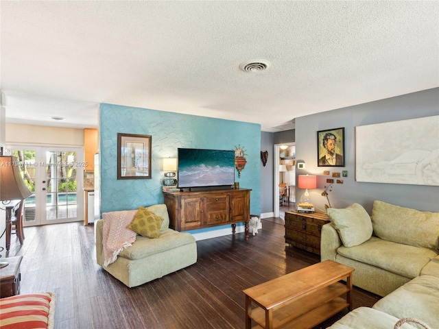 4400 NE 13th Ave, Oakland Park, FL 33334 - living room featuring baseboards, visible vents, a textured ceiling, and wood finished floors