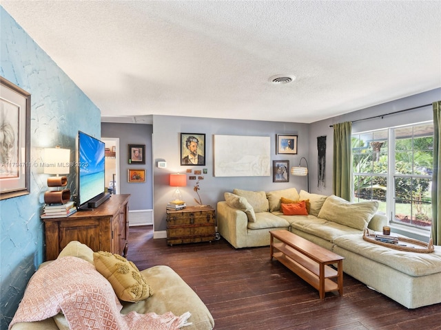 4400 NE 13th Ave, Oakland Park, FL 33334 - living room with a textured ceiling, dark wood-type flooring, and visible vents