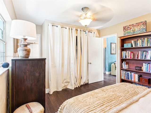 4400 NE 13th Ave, Oakland Park, FL 33334 - bedroom featuring baseboards and dark wood finished floors
