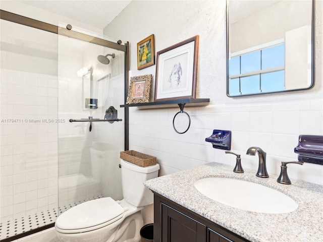 4400 NE 13th Ave, Oakland Park, FL 33334 - bathroom with vanity, toilet, tile walls, and a stall shower
