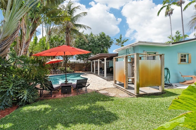 4400 NE 13th Ave, Oakland Park, FL 33334 - view of swimming pool featuring a fenced in pool, a fenced backyard, a patio area, and a yard