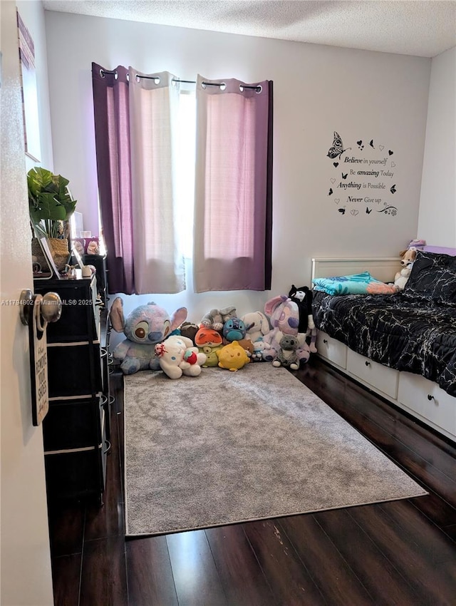 bedroom with wood finished floors