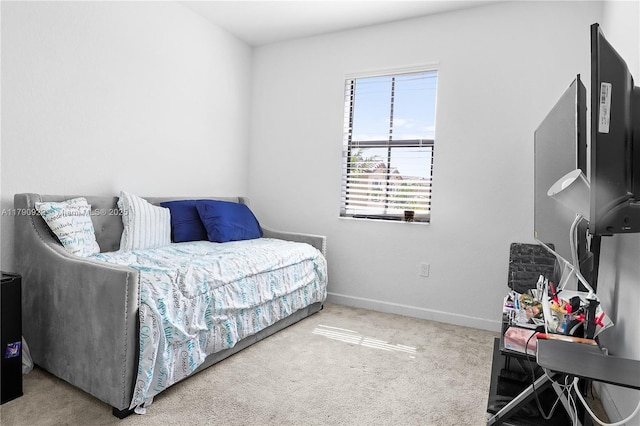 bedroom with carpet floors and baseboards