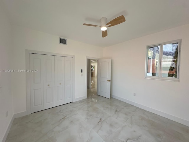 360 NE 118th St, Miami, FL 33161 - unfurnished bedroom with visible vents, marble finish floor, baseboards, and a closet