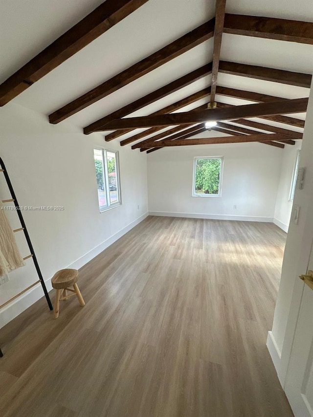 360 NE 118th St, Miami, FL 33161 - interior space with baseboards, lofted ceiling with beams, and wood finished floors