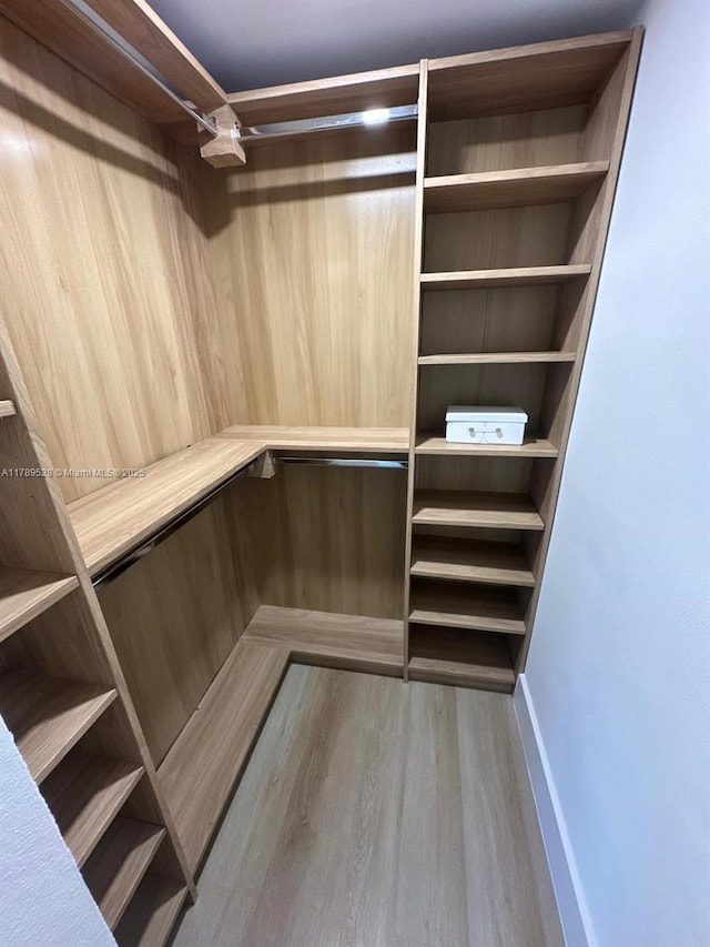 360 NE 118th St, Miami, FL 33161 - spacious closet featuring wood finished floors