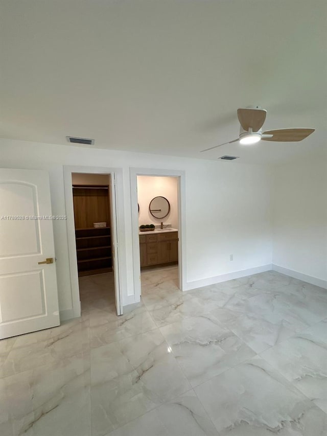 360 NE 118th St, Miami, FL 33161 - unfurnished bedroom featuring a spacious closet, baseboards, marble finish floor, and visible vents