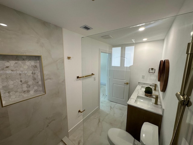 360 NE 118th St, Miami, FL 33161 - bathroom with visible vents, double vanity, marble finish floor, toilet, and recessed lighting