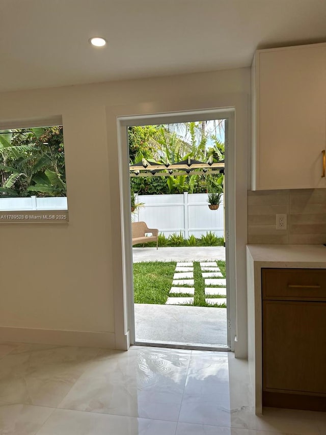 360 NE 118th St, Miami, FL 33161 - entryway with recessed lighting, baseboards, and marble finish floor